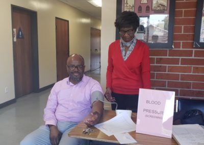 Blood Pressure Screenings at Lincoln - Kathryn Robinson Taking Rev Miller’s Blood Pressure