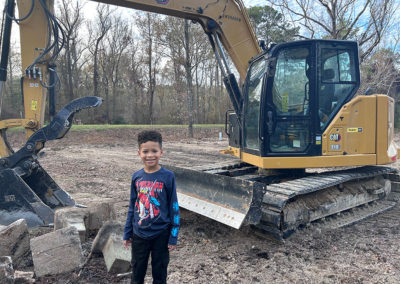 Young Man in Front of Tractor